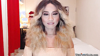 Blonde shemale wanks off in chair in front of webcam