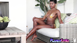 Bombastic ebony reveals her dark pussy