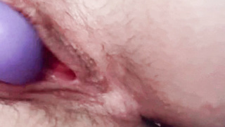 Play with my pussy with my purple vibrator