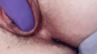 Play with my pussy with my purple vibrator