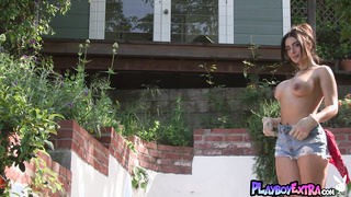 Nude latina muse watering her flowers