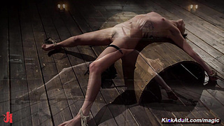 Bound babe with clamps and weights on sensitive areas