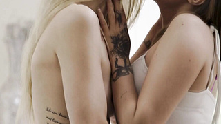 Two stunning lesbian fuck each other using strap on