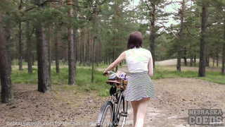 jilling in the forest after riding her bike nude