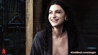 Blindfolded and chained to a column