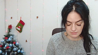 Brunette babe in grey sweater posing