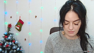 Brunette babe in grey sweater posing