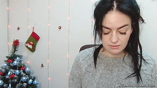 Brunette babe in grey sweater posing