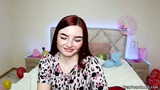 Cute redhead babe chats on webcam