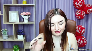 Redhead babe flashes big natural tits