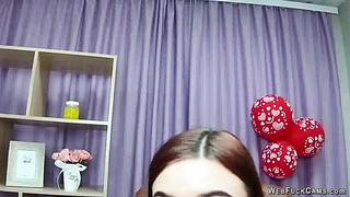 Redhead babe flashes big natural tits