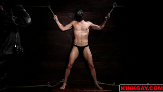 Ethan is on his stomach bound tight with rope