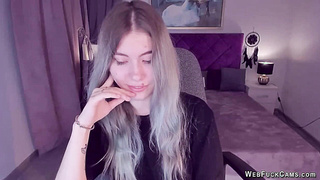 Blonde teen smoking and stripping off