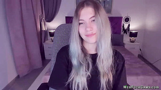 Blonde teen smoking and stripping off