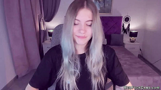 Blonde teen smoking and stripping off