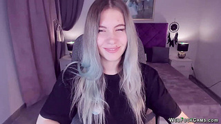 Blonde teen smoking and stripping off