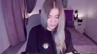 Blonde teen smoking and stripping off