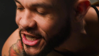 Buck on a dirty mattress inside a jail cell