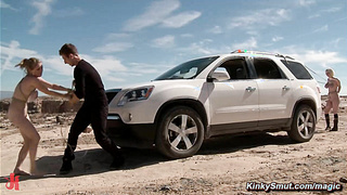 Man torments busty babes in a desert