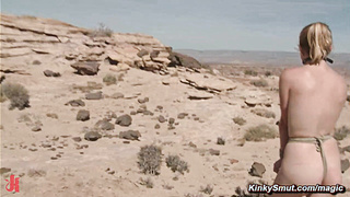 Man torments busty babes in a desert