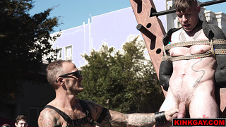 A crowd gathers to watch the [censored] flogging