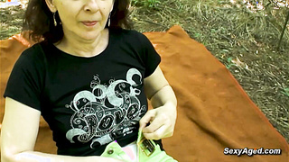 Hairy pussy granny fucks in the woods