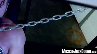 MuscleJockBound.com - Muscular man silenced with a ball gag while being heavily chained and mercilessly tormented in a dark dungeon
