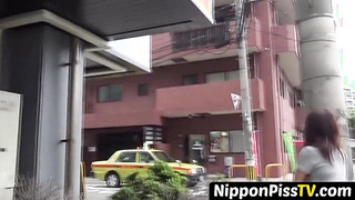 NipponPissTV.com - Naughty Japanese cuties openly pissing in the streets outdoors