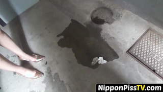 NipponPissTV.com - Nerdy Asian cocktease kneels for pissing behind tree outdoors