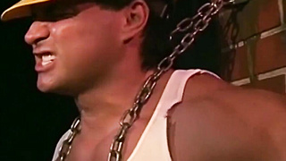 MuscleJockBound.com - Bound by chains, tattooed man in uniform endures rough and erotic domination