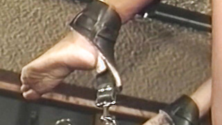 Busty blonde sub tied up for spanking in BDSM dungeon