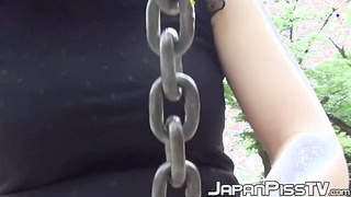 Naughty Asian babe close up pisses and outdoor pussy plays