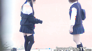 Young Asian babes caught on [censored] peeing in public
