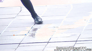 Young Asian babes caught on [censored] peeing in public