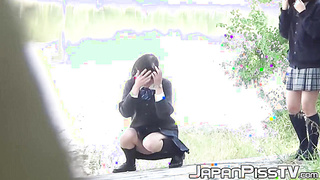 Young Asian babes caught on [censored] peeing in public