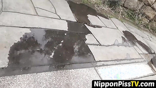 NipponPissTV.com - Real Japanese lady filmed while peeing in closeup outdoors