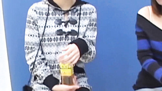 Asian honey with ample knockers is urinating while being observed