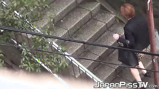 Mesmerizing Asian nymph urinating fastly outside during day