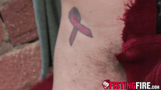 Enslaved Cameron Adams enjoys being strapped up while pleasing a grizzly dude