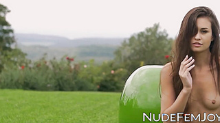 Fabulous nubile Demi Fray unsheathes her jaws watering assets in the grass