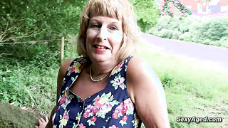 Grannie plays with her gash outdoor