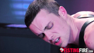 Bearded dom Brendan Patrick surrounds a teddy dude beefstick and nut with a steel ring