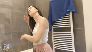 Bare-chested warm dark haired thin and naughty stunner in a pinkish mini micro-skirt to flash her fantastic rump and gams