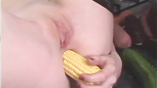 Red-haired Audrey Hollander in a fetish vignette pushing vegetables and fuck sticks in her fuckholes