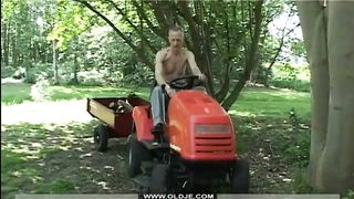Elder tractor driver drilling teenie on his tractor