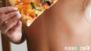 Teenage platinum-blonde with a giant butt slurping pizza