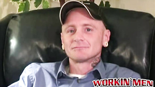 Fellow takes off down and flashes off all his tattoos and piercings