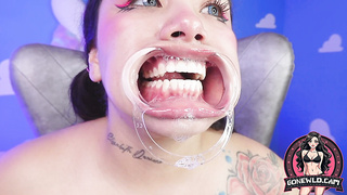 Tattooed Honey in Ring Gag Spits on Monstrous Faux-cock