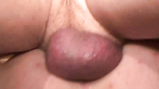 Aged butt hole bandit with tats plays with his lollipop solo
