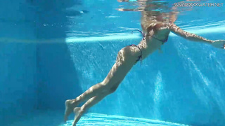 Mary Kalisy is lovin’ next to the swimming pool, thinking about a fellow she wants to poke